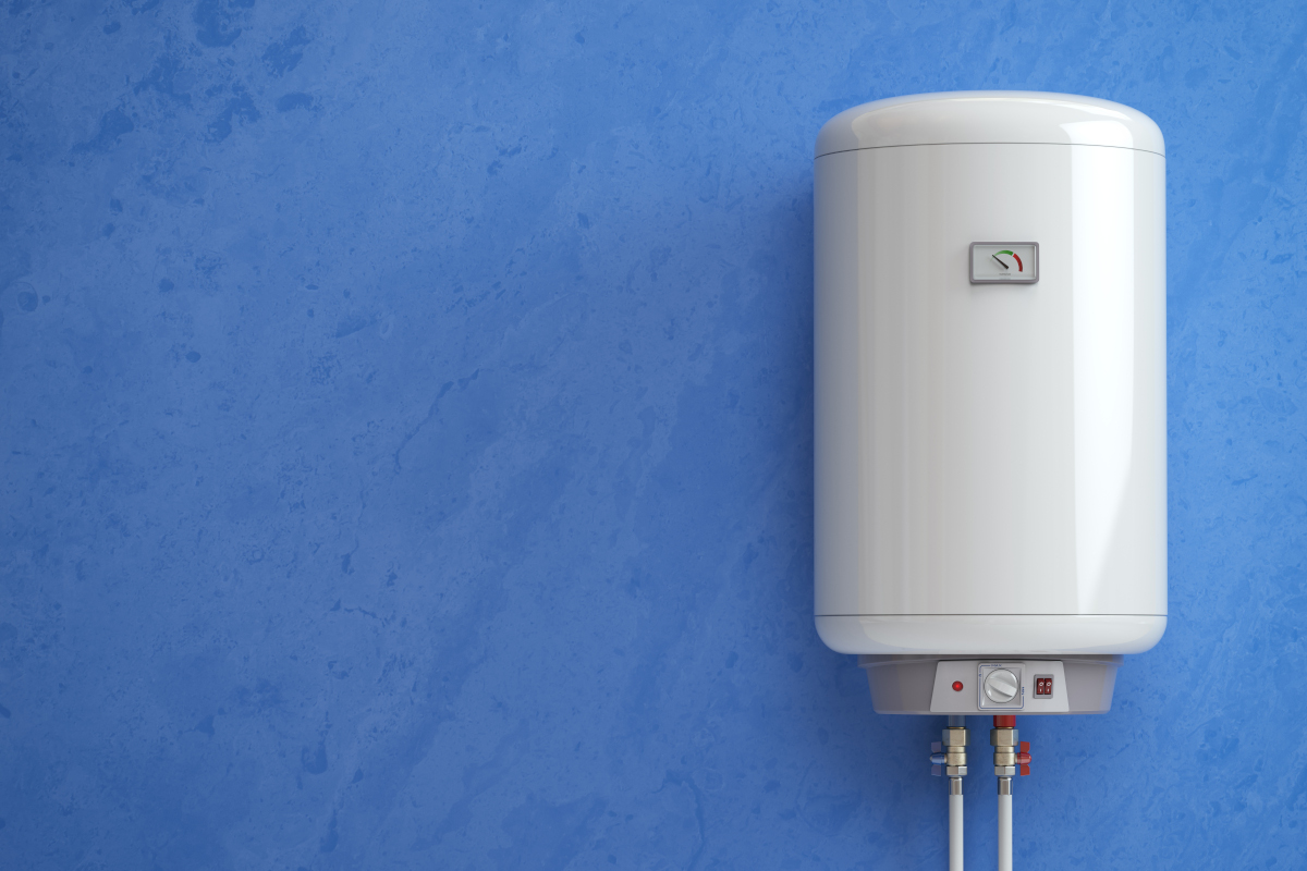 Electric hot water system tank mounted on a wall with temperature control and water pipe connections