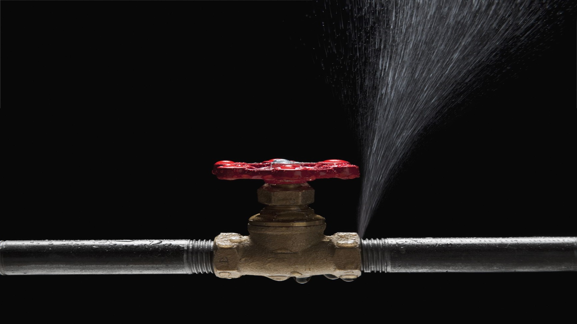 Burst pipe spraying water from a valve fitting – emergency plumbing repair Brisbane