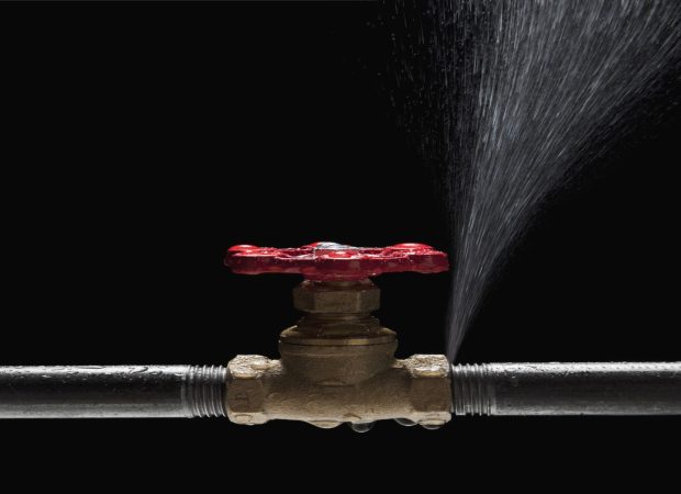 Burst pipe spraying water from a valve fitting – emergency plumbing repair Brisbane